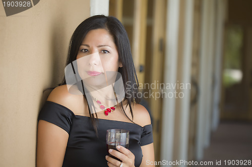 Image of Attractive Hispanic Woman Portrait Outside Enjoying Wine