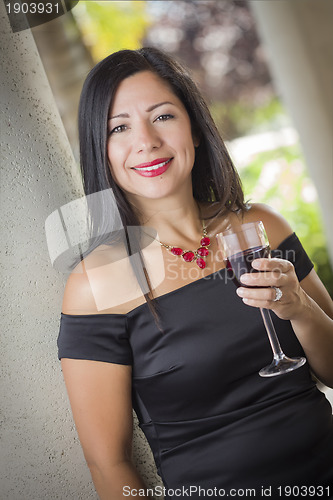 Image of Attractive Hispanic Woman Portrait Outside Enjoying Wine