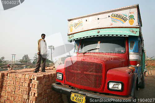 Image of Brick field workers carrying complete finish brick from the kiln