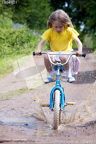 Image of little girl on the bicycle