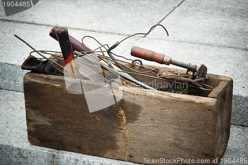 Image of old wooden box with tools 