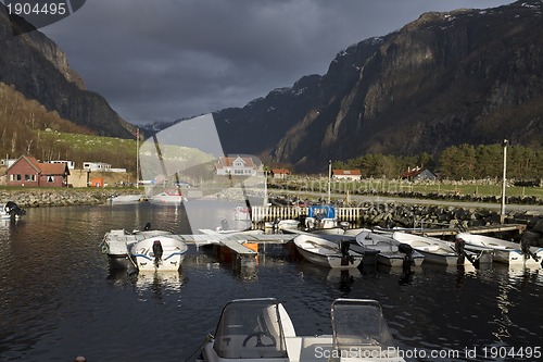 Image of small harbor with mountains in background