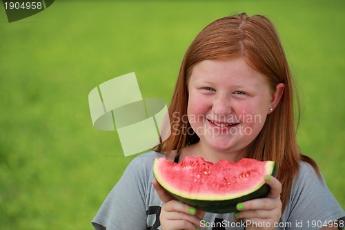 Image of Girl eating a watermelon