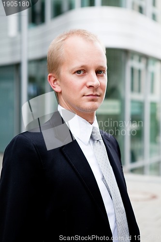 Image of succsessful business man with tie and black dress 