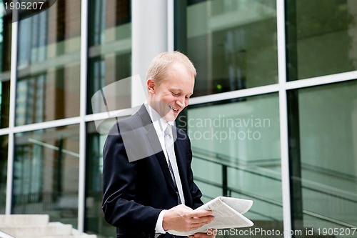 Image of succsessful business man with tie and black dress 