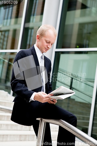 Image of succsessful business man with tie and black dress 