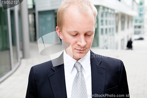 Image of succsessful business man with tie and black dress 