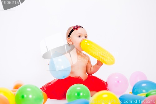 Image of cute little baby child with colorfull balloons birthday