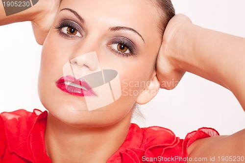 Image of beautiful brunette woman with red lips and makeup