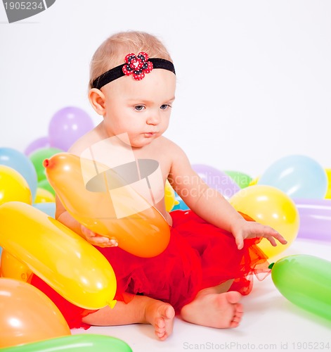 Image of cute little baby child with colorfull balloons birthday