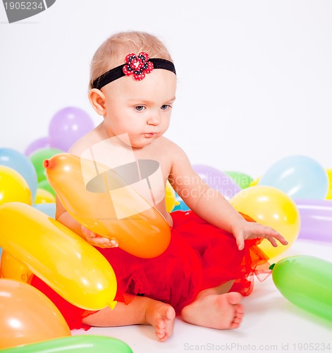 Image of cute little baby child with colorfull balloons birthday