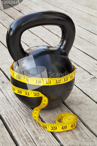 Image of kettlebell and measuring tape