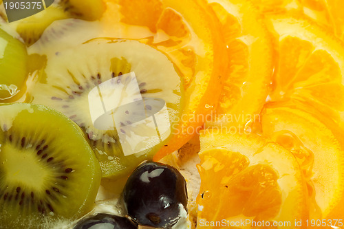 Image of kiwi, grapes and orange topping