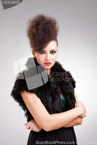 Image of glamour woman in black dress with fur 