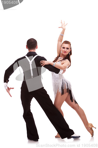 Image of back of a latino dancing couple