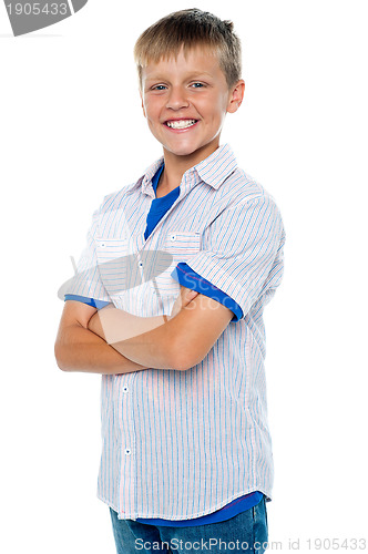 Image of Confident young boy posing in casuals