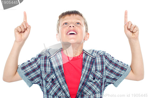 Image of Smiling young child looking up and pointing