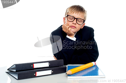 Image of School boy in glasses dozing off