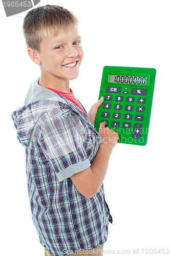 Image of Pleasant young student using a large green calculator