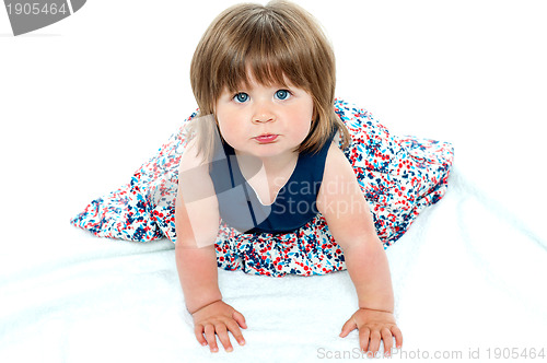 Image of Adorable baby girl crawling