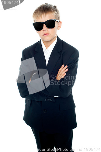 Image of Snapshot of young kid wearing suit and sunglasses