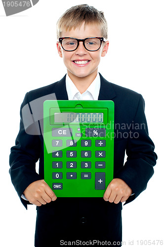 Image of Bright young kid holding large green calculator