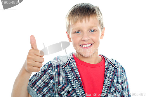 Image of Boy in trendy clothes showing thumbs up sign