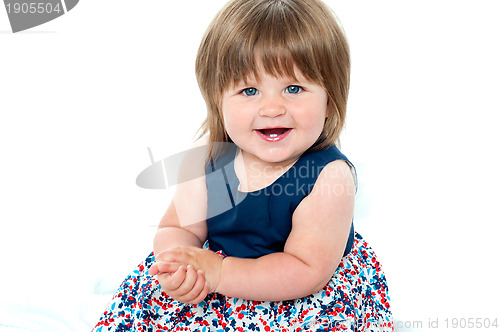 Image of Portrait of an adorable baby girl sitting up