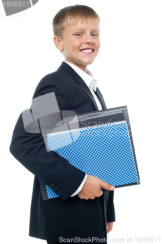 Image of Cheerful little boy holding business files