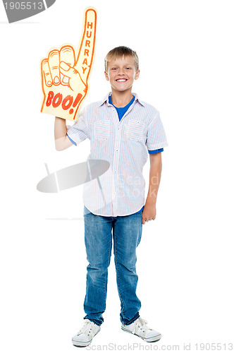 Image of Young boy wearing a large foam hand