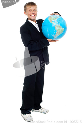 Image of Smart looking young kid holding globe