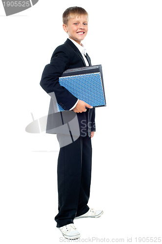Image of Smiling kid holding files, young business boy