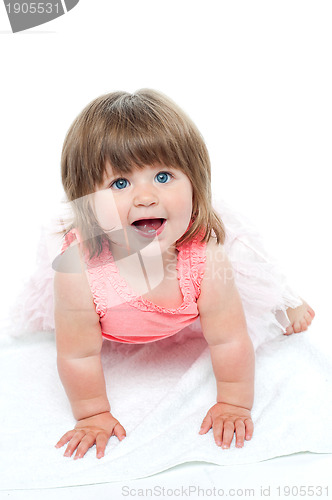 Image of A cute little baby girl is staring up