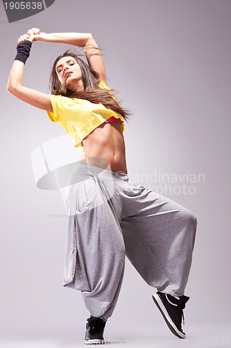 Image of young stylish girl dancing