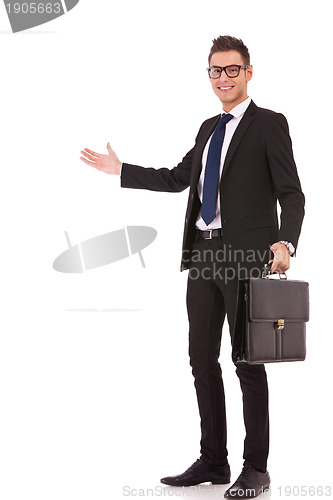 Image of business man with a briefcase welcoming