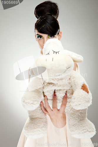 Image of Brunette girl with teddy bear 