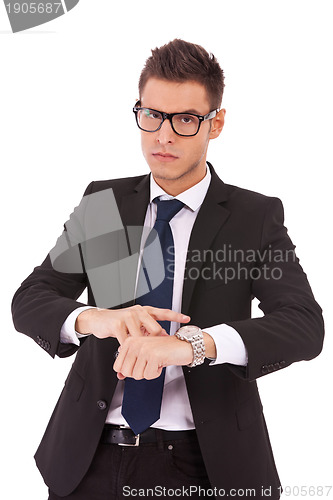Image of business man showing you that you are late