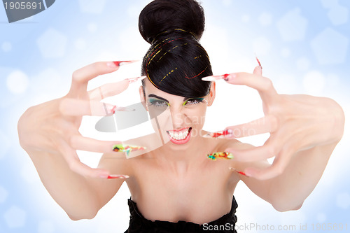 Image of woman showing her big fancy nails