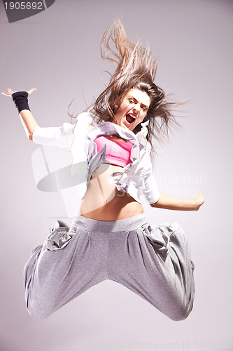 Image of  cool woman dancer jumping in mid air