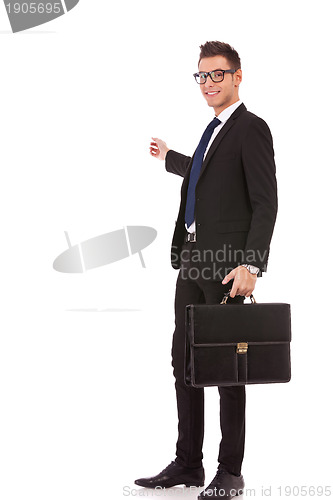 Image of business man with briefcase presenting