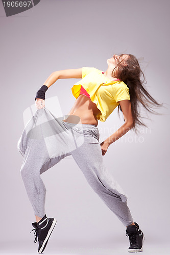 Image of woman dancer in a full of energy dance pose