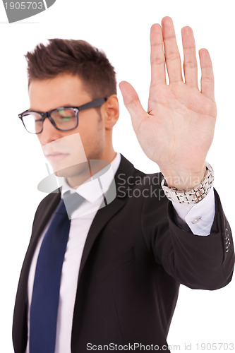 Image of Business man making stop sign 