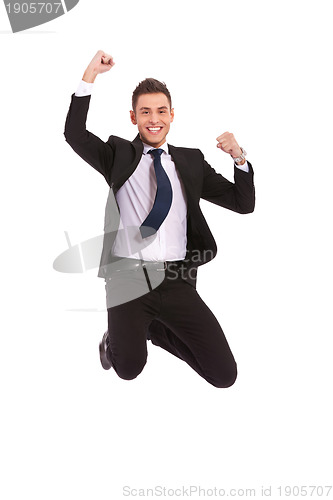 Image of extremely excited business man jumping