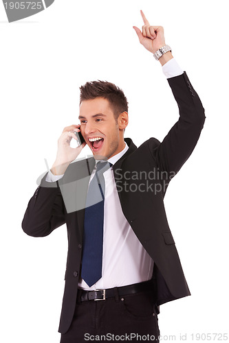 Image of winning business man on the phone