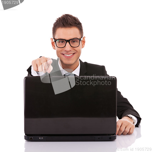Image of entrepreneur at his desk working on laptop