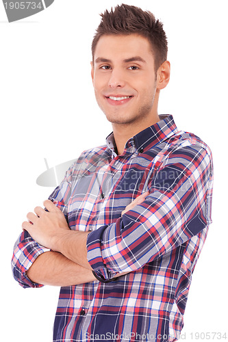 Image of man casually posing with arms crossed