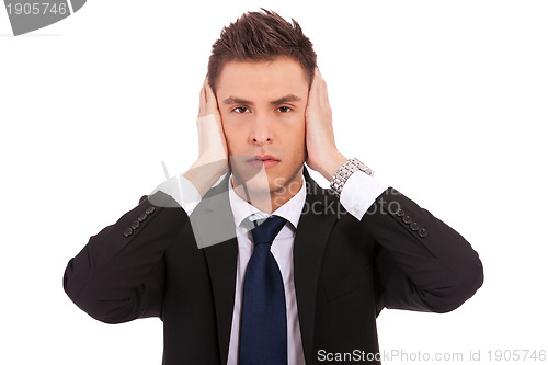 Image of business man in the Hear no evil pose