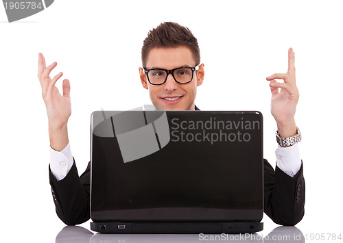 Image of businessman at his desk with a laptop