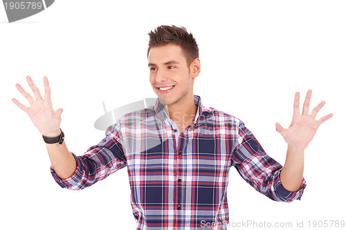 Image of man pushing with his palms an imaginary keyboard