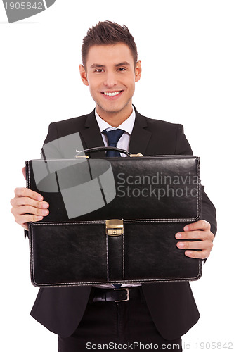 Image of business man offering a black briefcase 